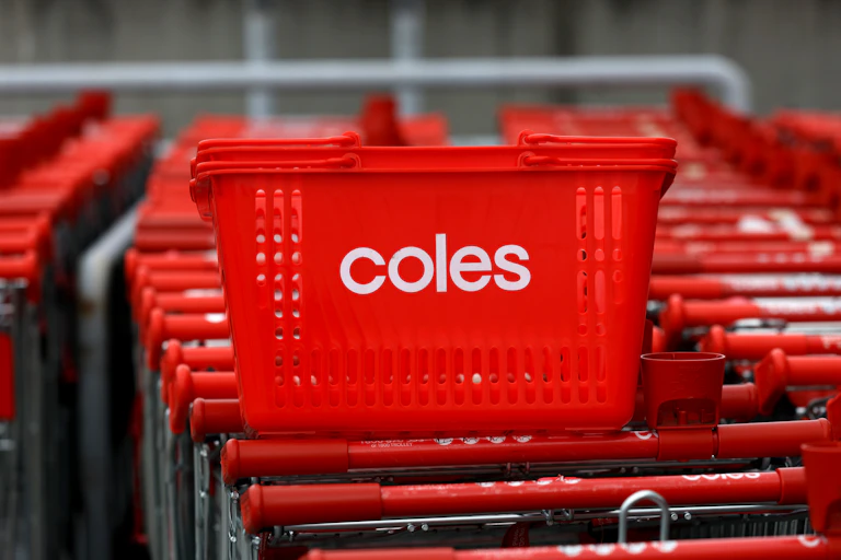 Coles shopping baskets and trolleys are seen at a Coles supermarket