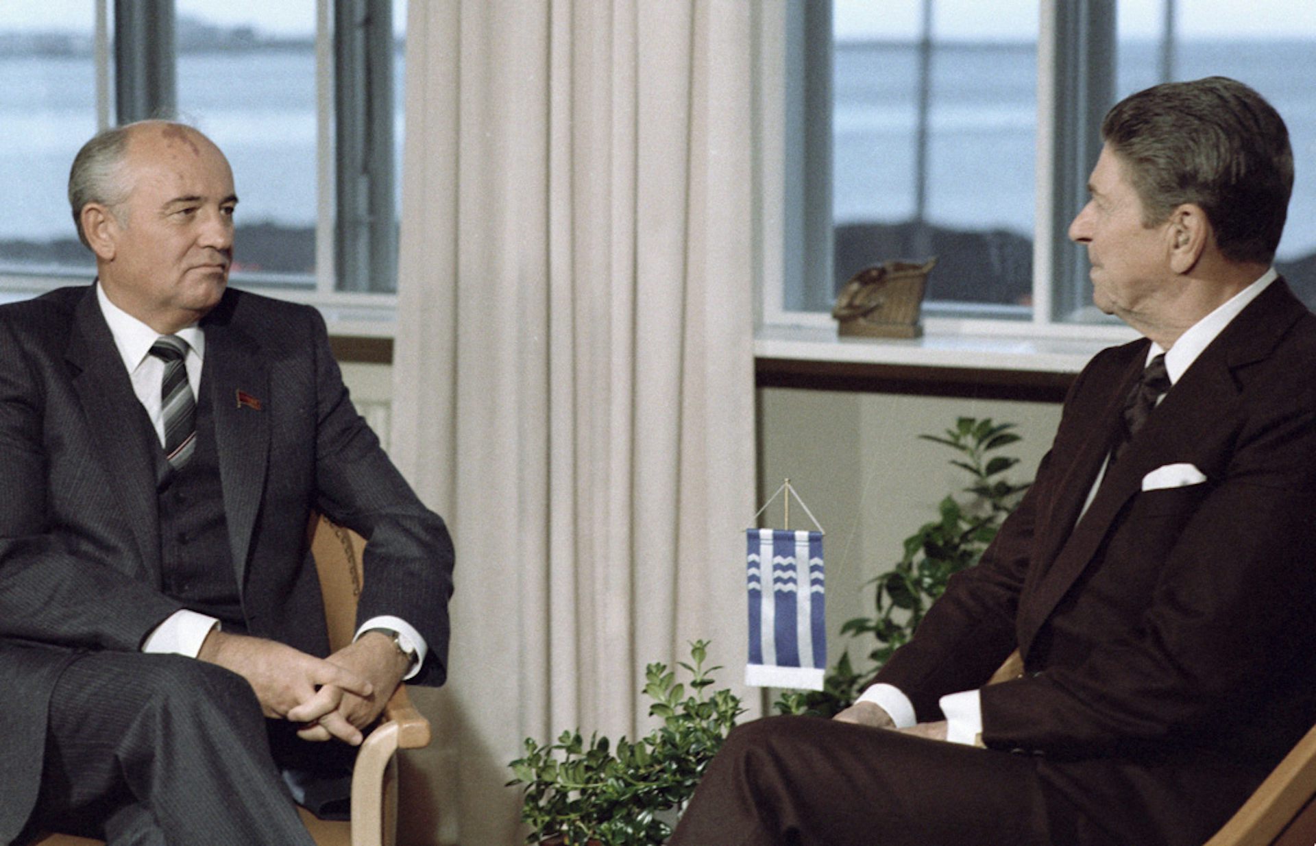 Mikhail Gorbachev sits with Ronald Reagan