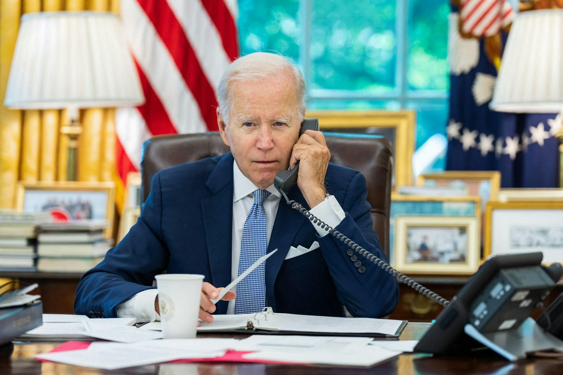 Joe Biden on the telephone in the Oval Office