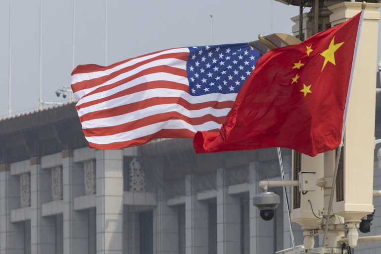 The US and Chinese flags flutter at Tiananmen Square in Beijing.