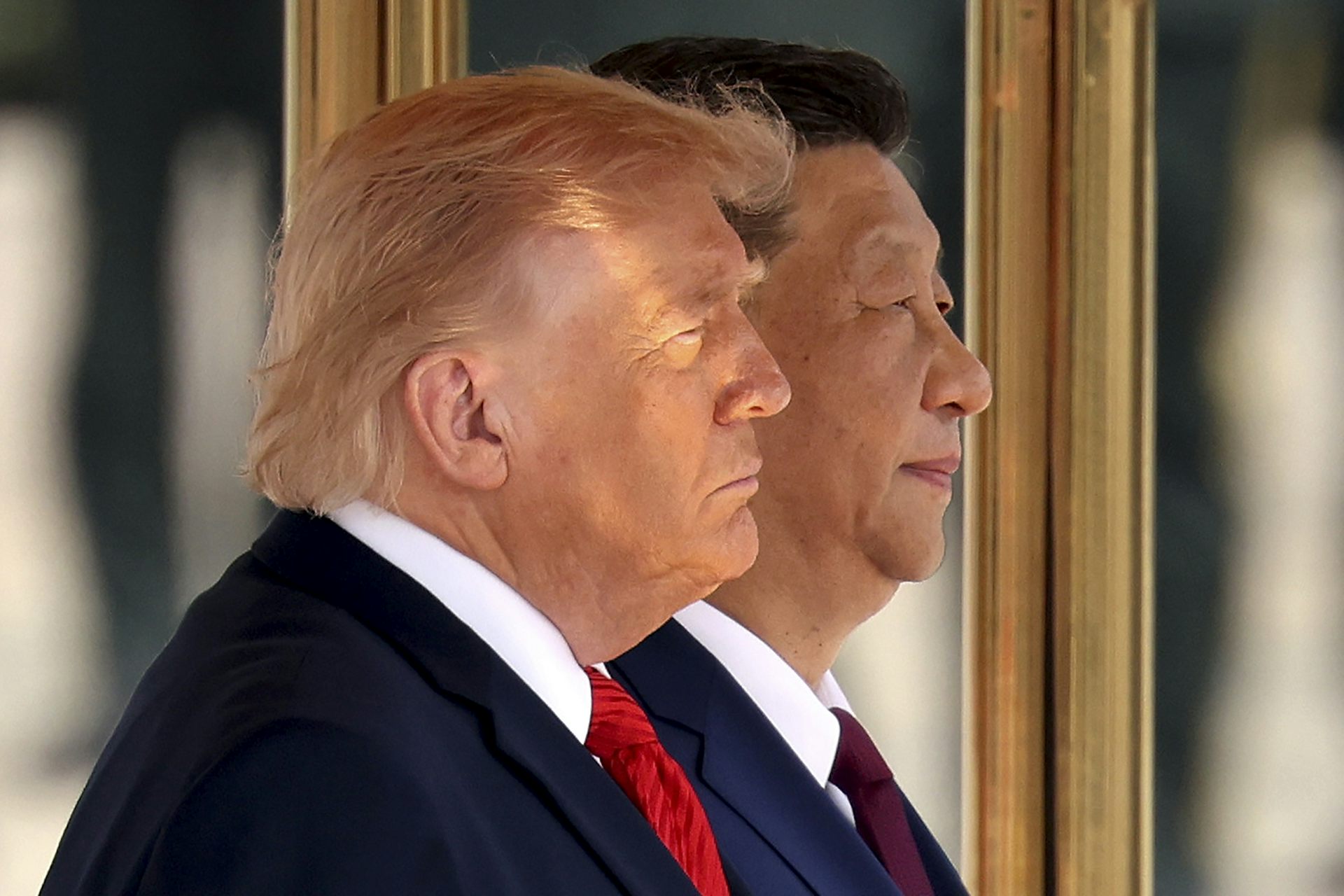 Xi Jinping sits alongside Donald Trump at a welcome ceremony in Beijing.