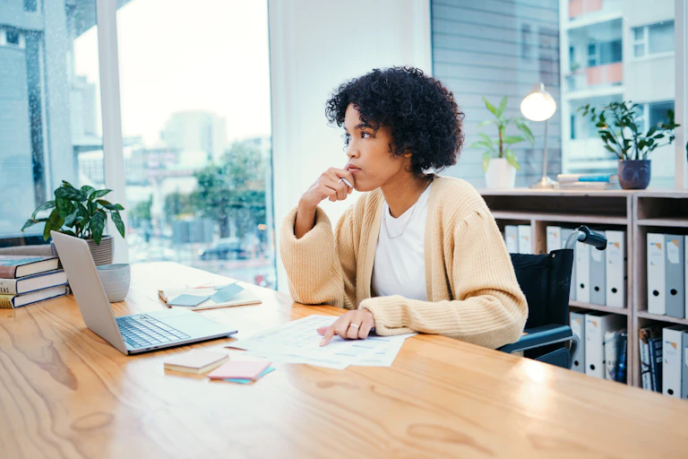 Woman in office thinking