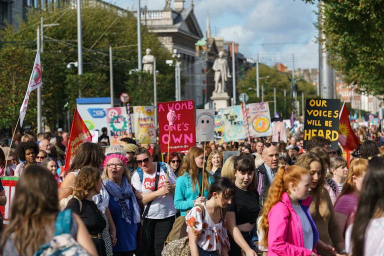 People holding placards campaigning for abortion rights.
