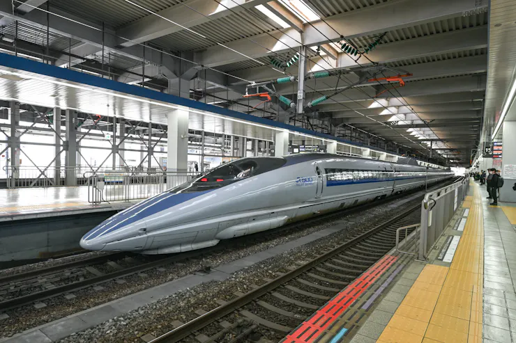 A high-speed train in a station.