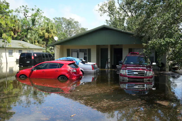 home and cars under water at a home in Tampa