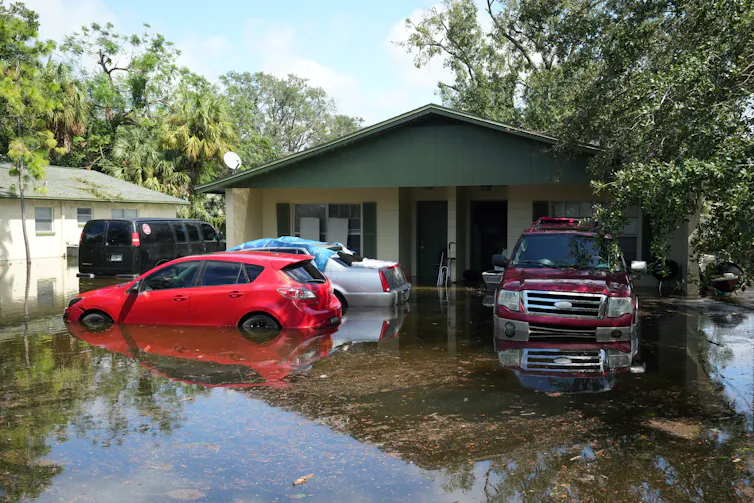 home and cars under water at a home in Tampa
