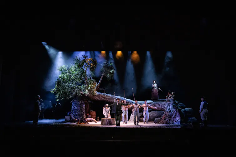 Production image: the full stage, complete with dancers.