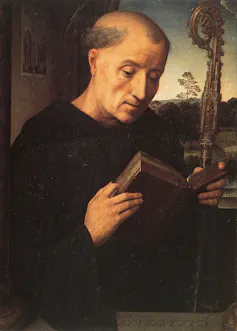 Painting of Saint Benedict holding a staff and reading from a book.