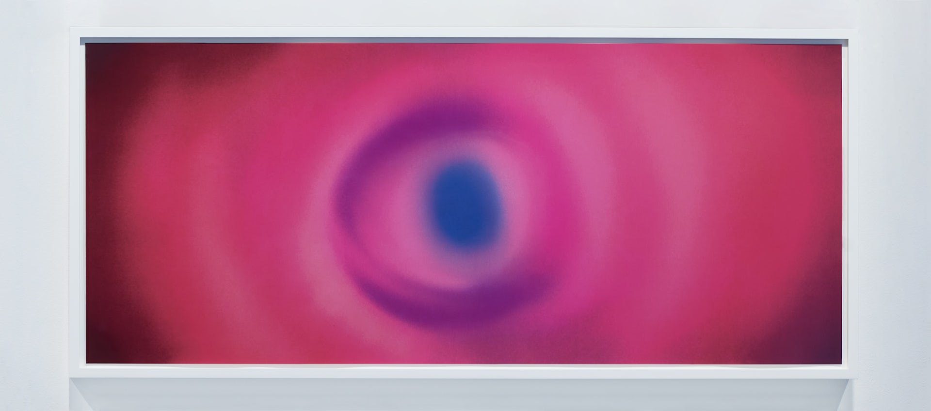 Pink circles of light with a blue thumbprint-shaped circle in the centre