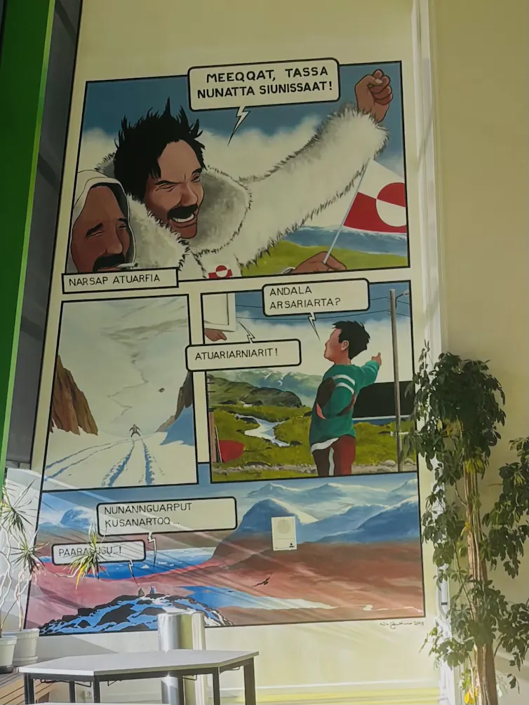 A comic-strip styled mural by the artist Konrad Nuka Godtfredsen in Narsaq, South Greenland.
