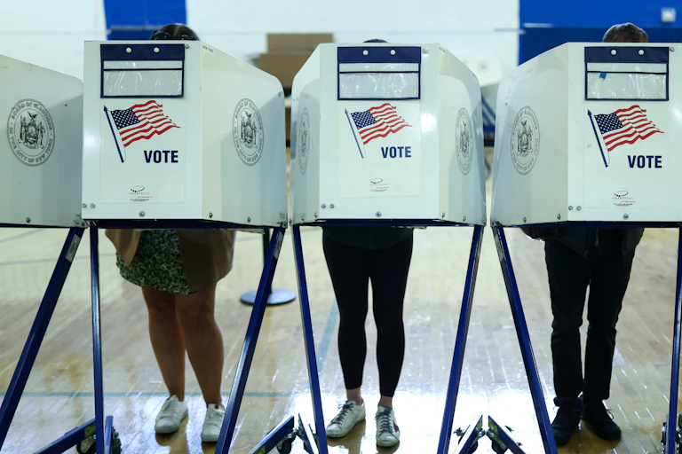 Voters mark ballots inside an early voting polling center in Manhattan, Oct. 27, 2025