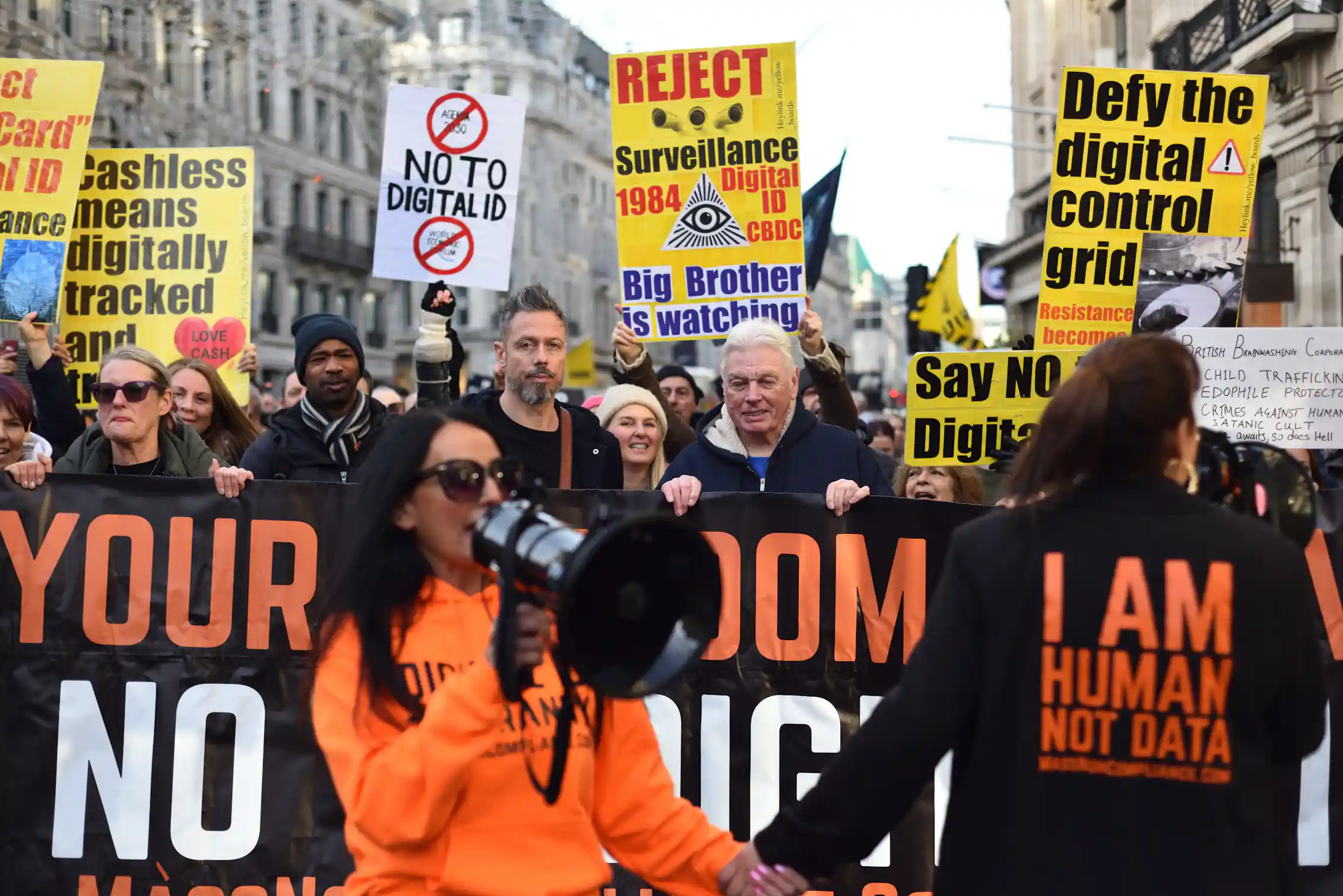 A crowd of people protesting against digital ID