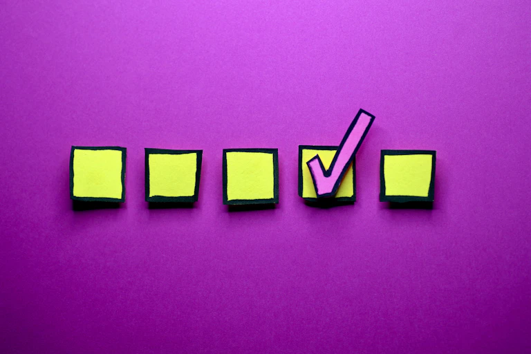 Five yellow boxes, one with a checkmark in it