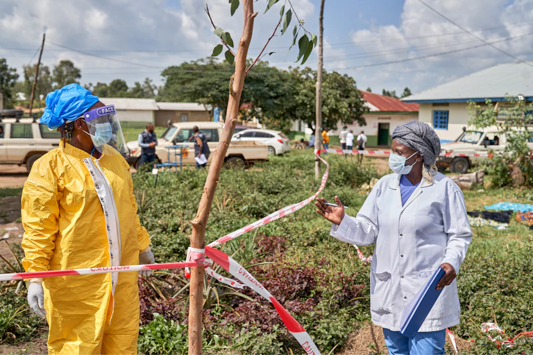 Health workers chat at an Ebola treatment centre in Bunia, Congo on Tuesday