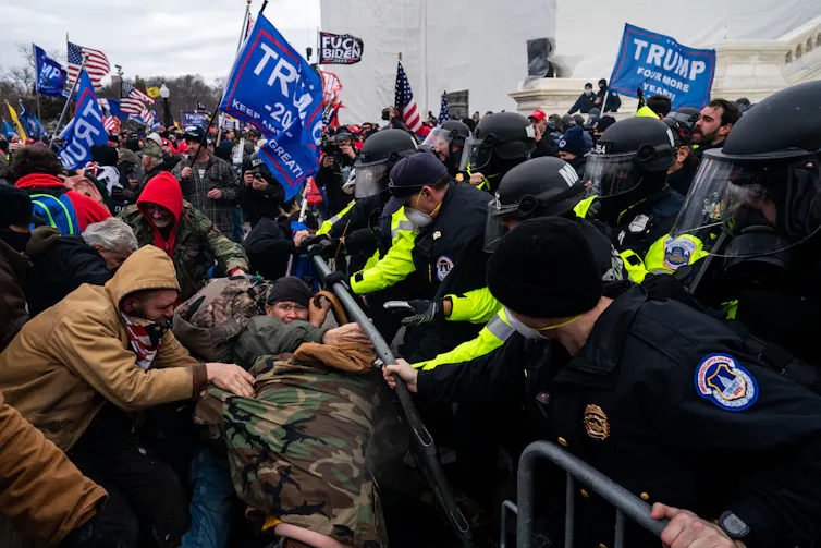When a president settles his personal lawsuit to create a fund for allies, elementary questions on justice get up 1 A melee featuring angry people on one side and police on the other, battling.