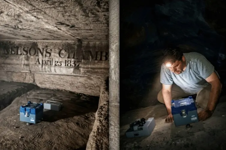 Man crouching in stone chamber with instruments
