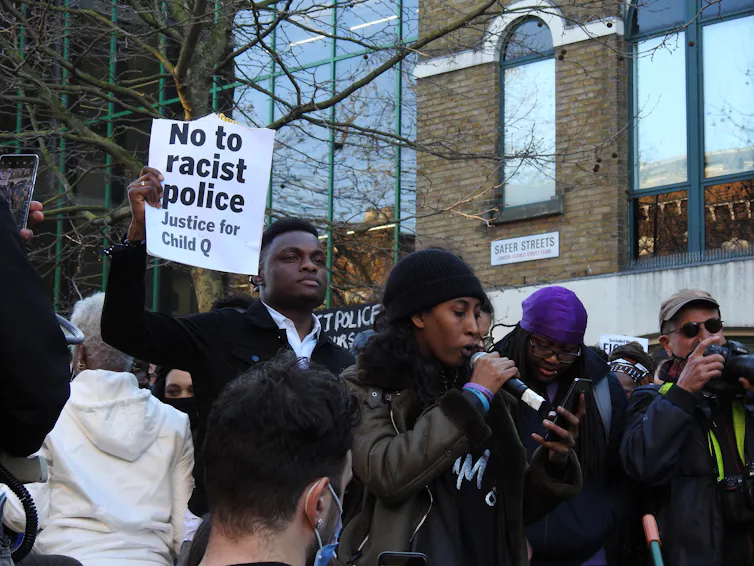 Marchers with a sign that says 'no to racist police, justice for Child Q'