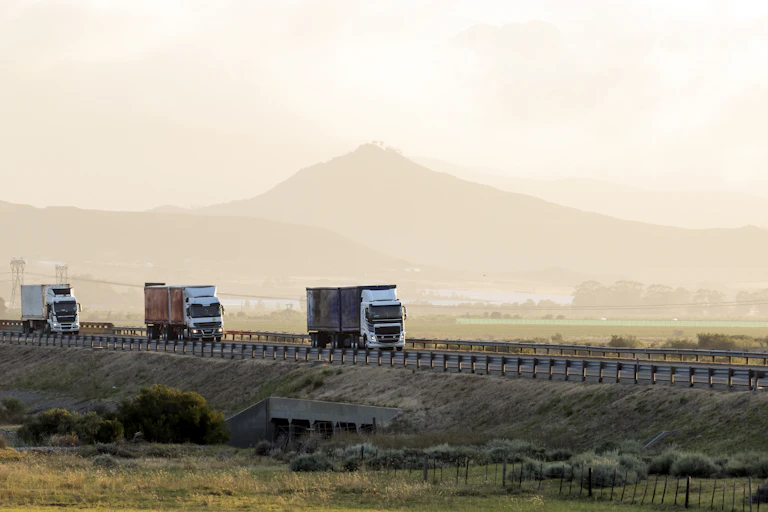 Three trucks on a road