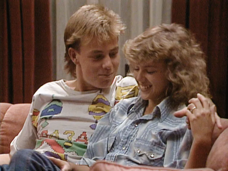 Neighbours still: Charlene and Scott sit on a couch.