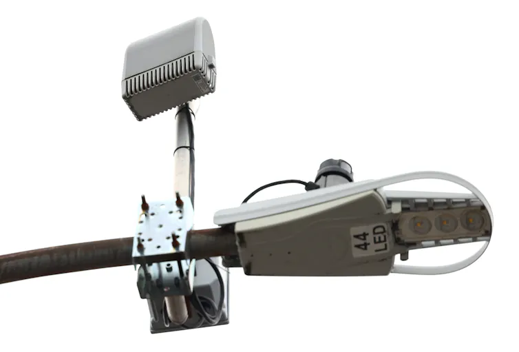 A piece of gun detection technology secured on a light pole