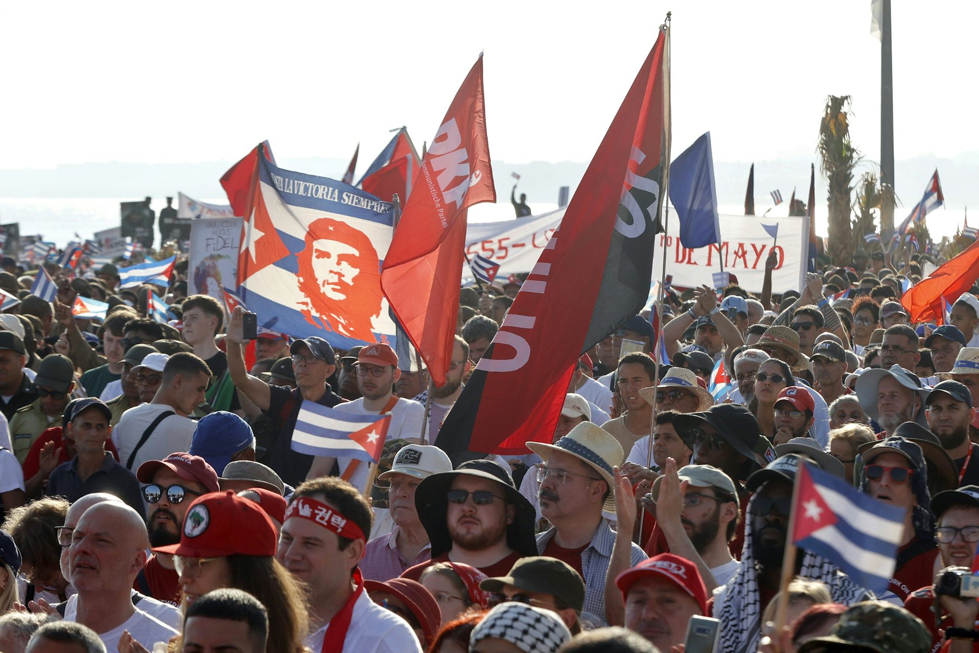 Cubans waves flags at a rally in Havana.