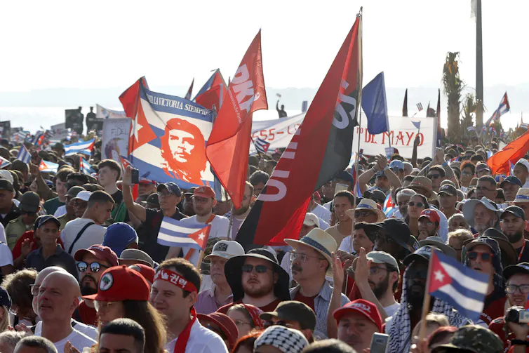 Cubans waves flags at a rally in Havana.