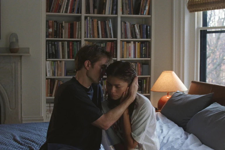 Charlie whispers into Emma's ear