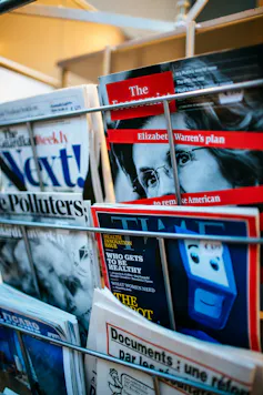A few magazines on a rack.