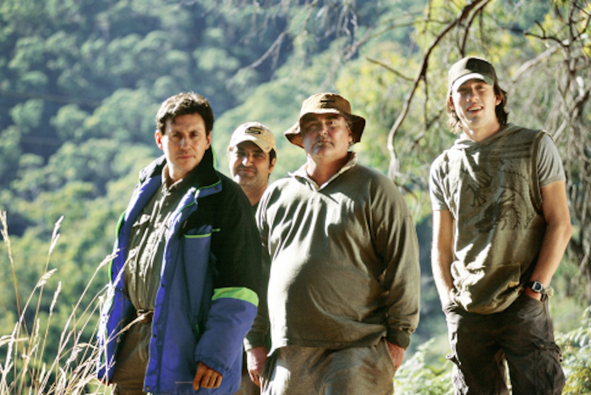 four men standing in Australian wilderness