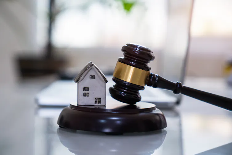 House with gavel. Real estate law and house auction concept.