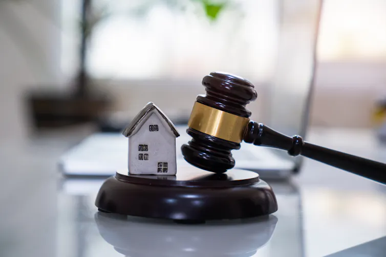 House with gavel. Real estate law and house auction concept.