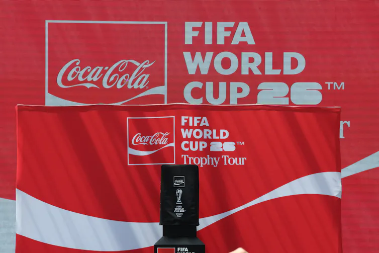 A red banner featuring the Coca-Cola logo and the text 'FIFA World Cup 26.'