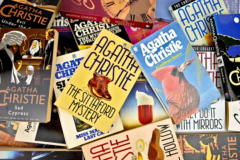 A scatter of paperback novels by Agatha Christie.