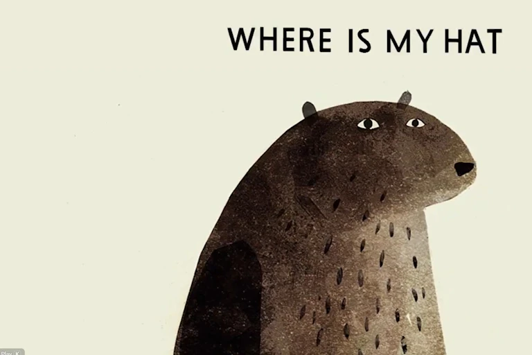 Illustration of a bear looking mildly annoyed and ponderous under the words 'where is my hat?'