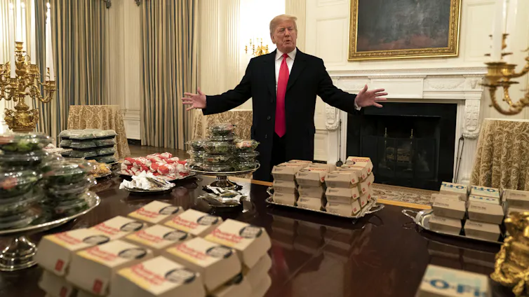 Donald Trump with junk food, including McDonald's, in the White House