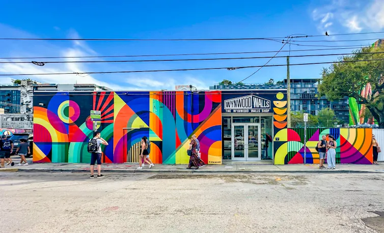 A shop entrance with walls painted in bright colours.