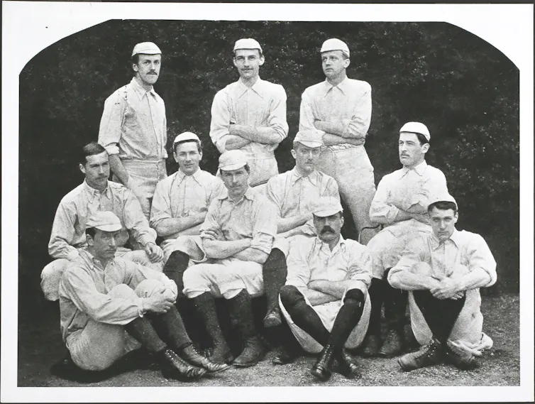 Soccer players pose for a photo.