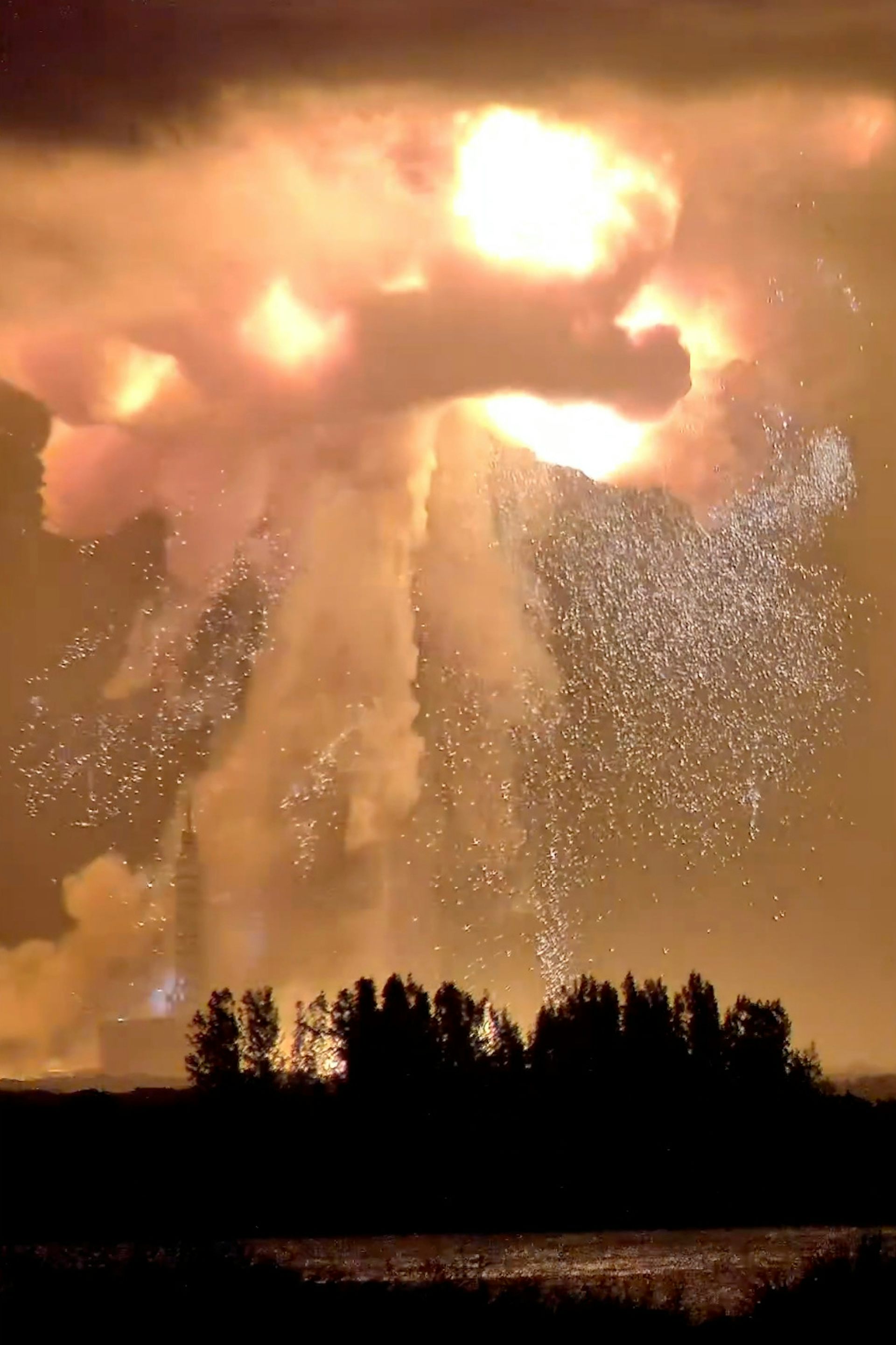 A huge explosion of flame, smoke and showering sparks.