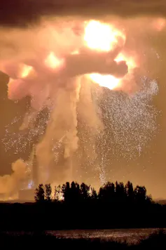 A huge explosion of flame, smoke and showering sparks.
