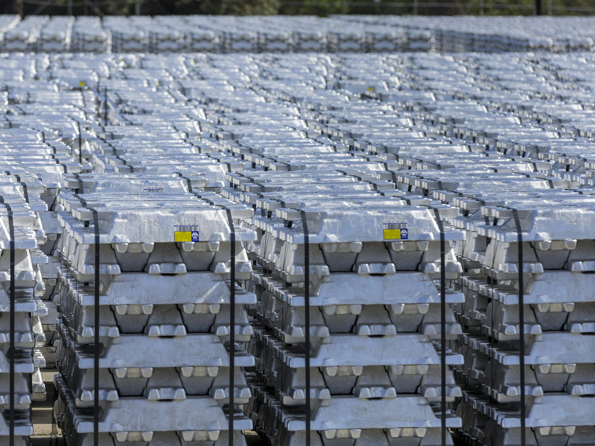 Stacks of aluminium bricks in a row.