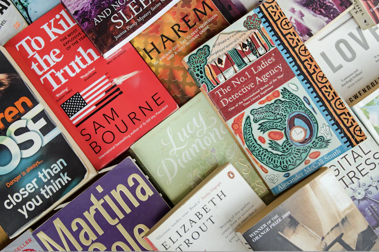A pile of popular books showing the covers.