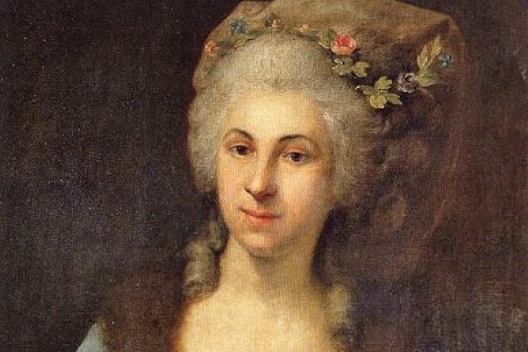 A woman dressed in late 18th-century wig and dress.