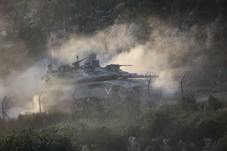 A tank operates in a hilly environment.