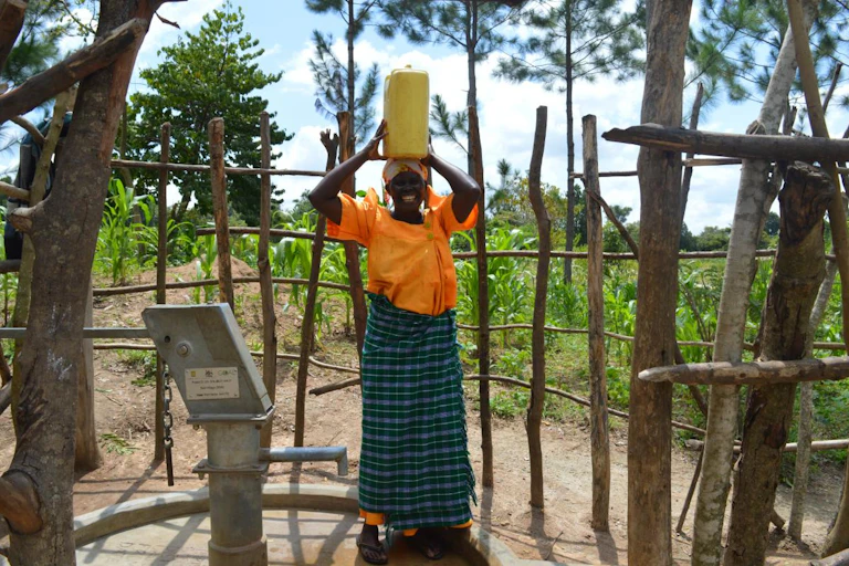 Woman carrying a container on her head