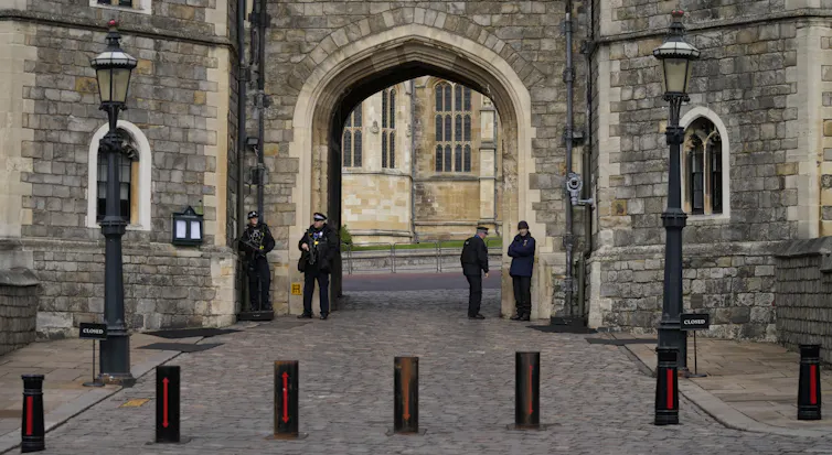 police guard the gate to windsor castle