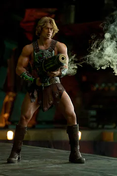He-Man shooting a gun.