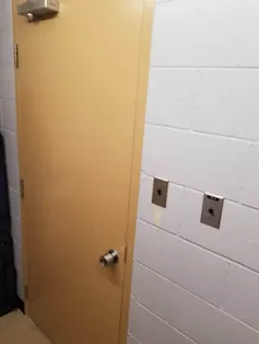 An image of a closed classroom door.