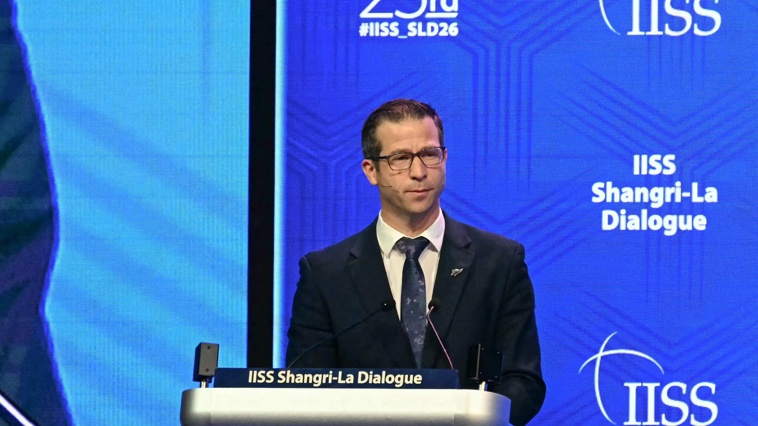 Chris Penk speaking at a lecture at the defence summit in Singapore