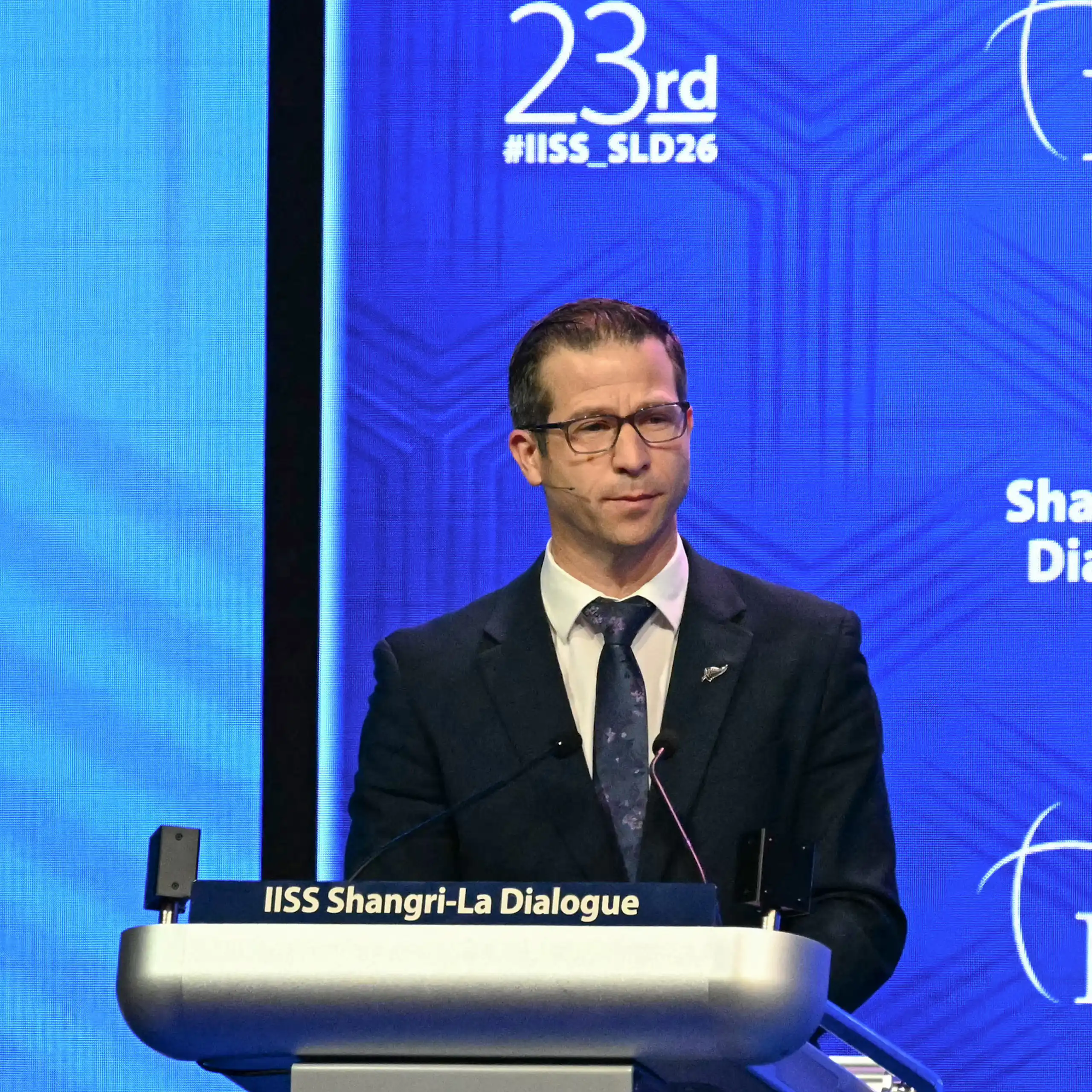 Chris Penk speaking at a lecture at the defence summit in Singapore