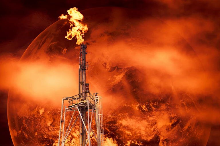 red fire methane gas flare, background of red earth